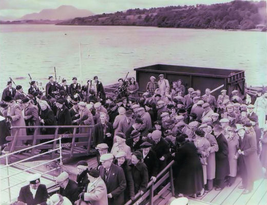 Band on Balloch pier as senior citizens outing boards the steamer.